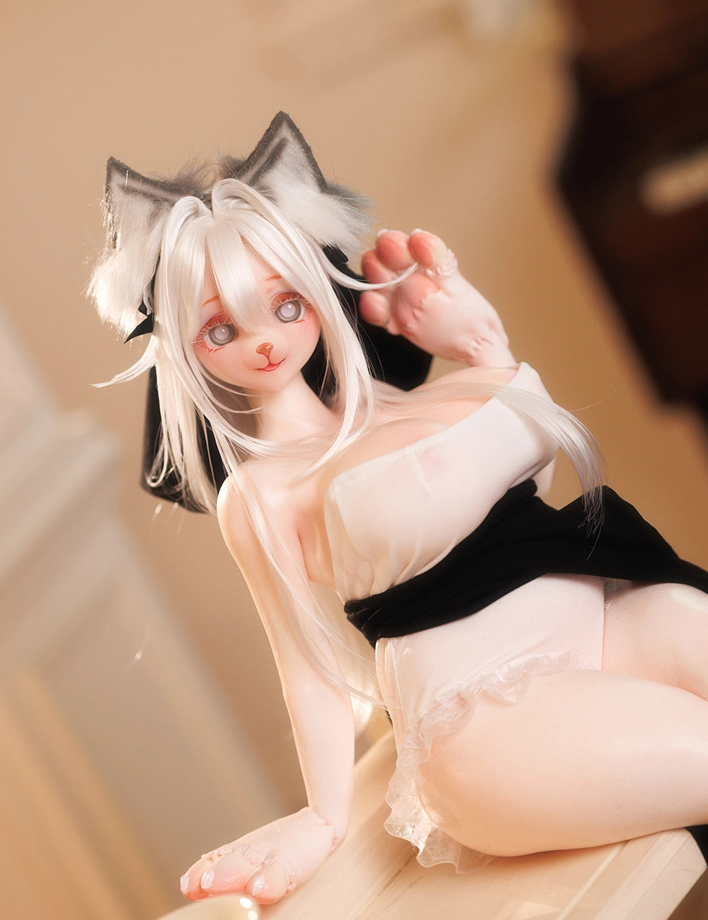 A flexible furry sex doll with white hair and cat ears.