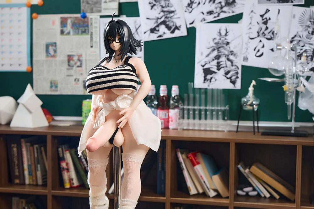 Image of The Sinesian anime figure sitting on a desk and holding a big dildo.
