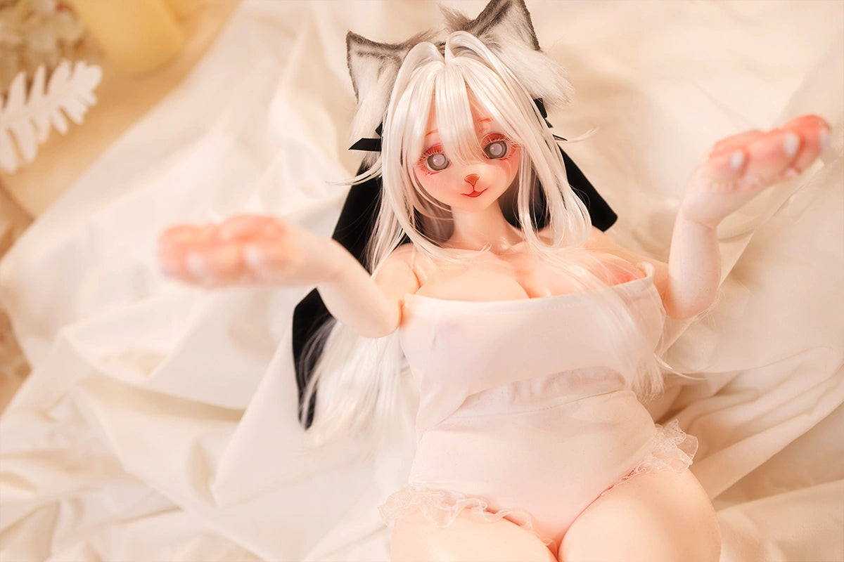 Image of Overhead view of a playful neko hentai anime sex doll with white hair and cat ears.