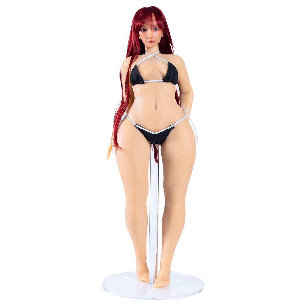 Image of The Pornhub Star Pufffypink Mini Sex Doll in a black string bikini, standing on a clear base.